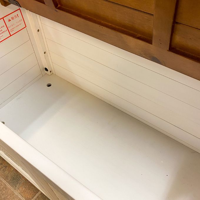 Wooden storage chest with a white interior. White Dashbury Storage Trunk available at Rustic Ranch Furniture and Decor.