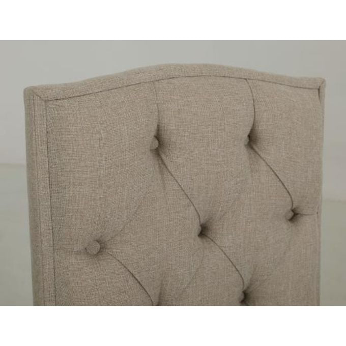Beige tufted dining chair back on the Marquez Dining chair available at Rustic Ranch Furniture and Decor.