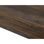 Close-up of a wooden surface with a dark brown finish. Loft Brown Counter Height Sofa Table available at Rustic Ranch Furniture and Decor.
