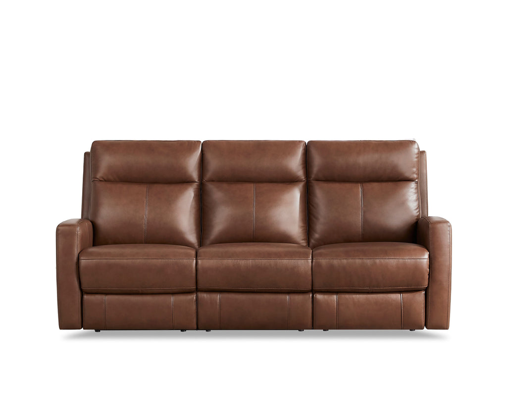 Brown leather sofa on a white background. Vienna Reclining Sofa available at Rustic Ranch Furniture and Decor.